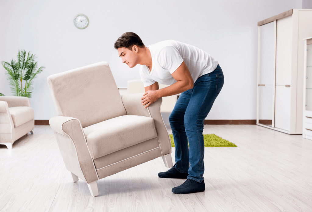 a picture of a man moving a chair by himself