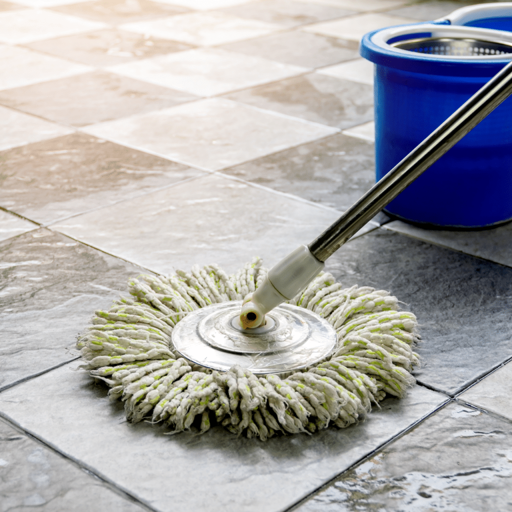 A picture of a mop cleaning an apartment floor.